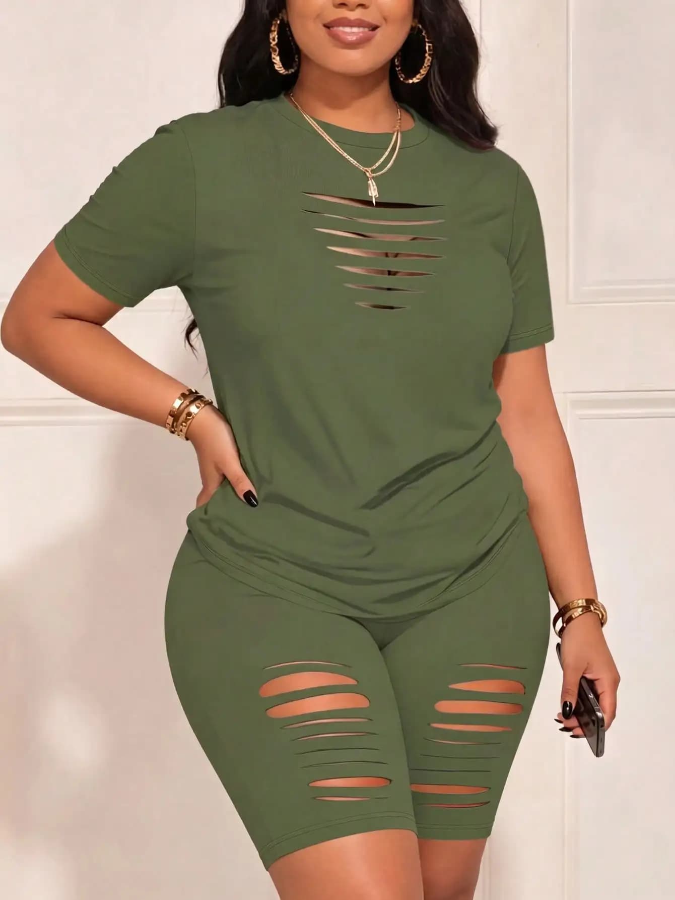 Stylish hollow ripped two‑piece outfit for plus size ladies. Stretchy comfy material, eye‑catching cut‑out design, great for hang out, fitness, jogging, daily wear.