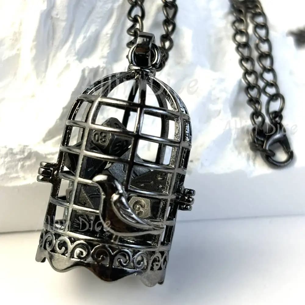 Mini set di dadi in metallo con gabbia per uccelli in metallo con collana Dadi DND 7 pezzi Scatola di dadi in metallo poliedrico per dadi Dungeons e Dragon D&D RPG