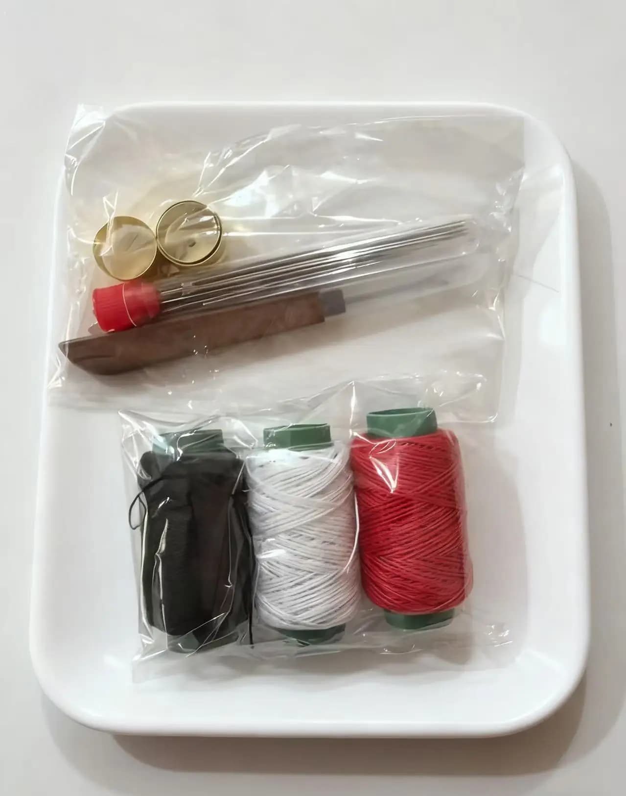 This is a household sewing needle and thread kit, which is a practical tool set for sewing and mending clothes and quilts on a daily ba