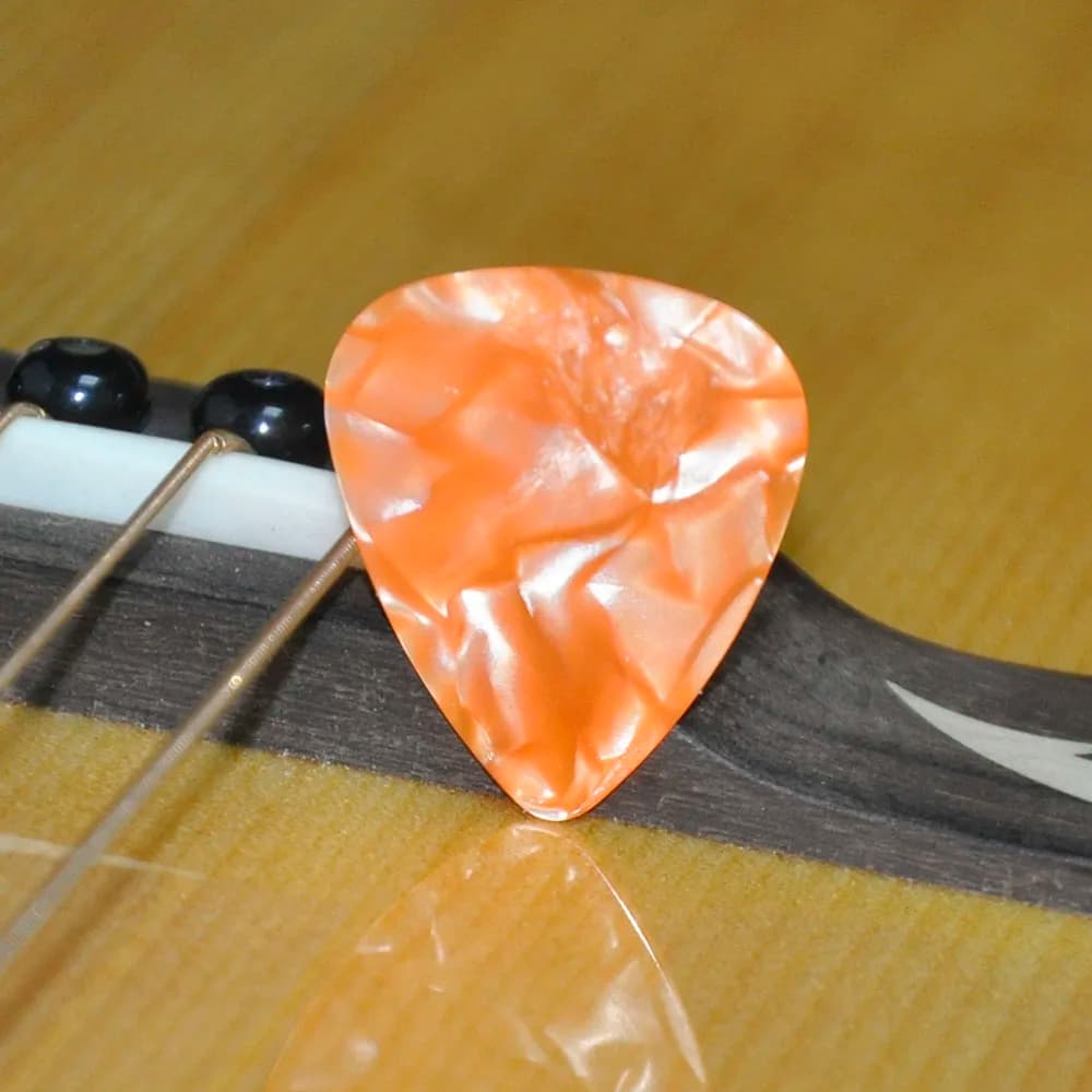 100 pz/lotto 0.46 millimetri 0.71 millimetri Arancione Perla Celluloide Guitar Picks Plettri per Chitarra Acustica Basso Elettrico