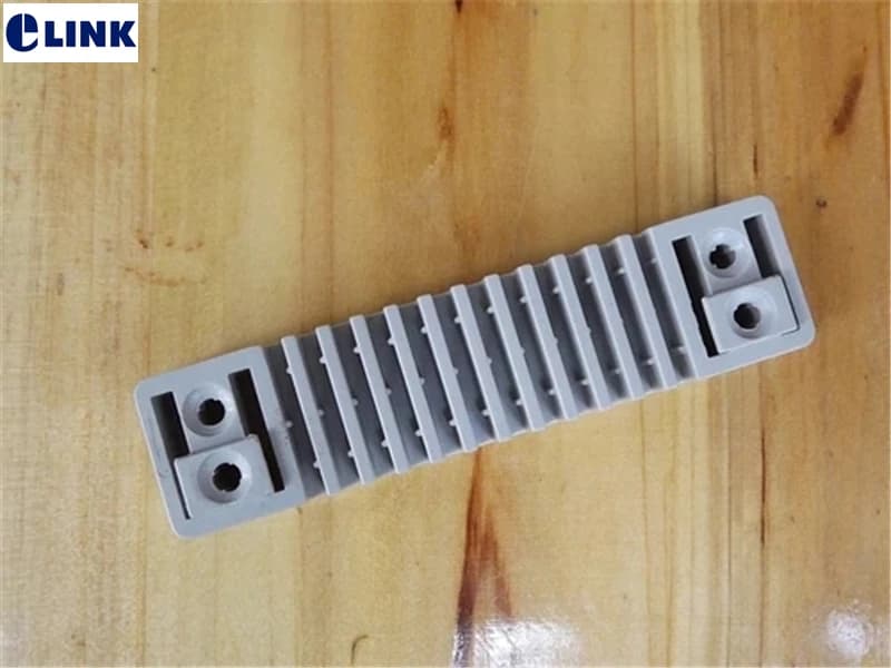Piastra di fissaggio per cavo in fibra a 12 posizioni, scanalatura per cavo drop, scanalatura per morsetto, sedile fisso per cavo in fibra a 12 conduttori Tipo impilato ELINK 100 pezzi