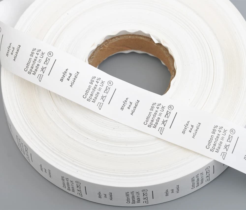 Larghezza 25 mm Design su misura Etichette per la cura del lavaggio dell'indumento Etichette per dimensioni del materiale TAFFETA in NYLON Etichette lavabili Nastro bianco Design nero