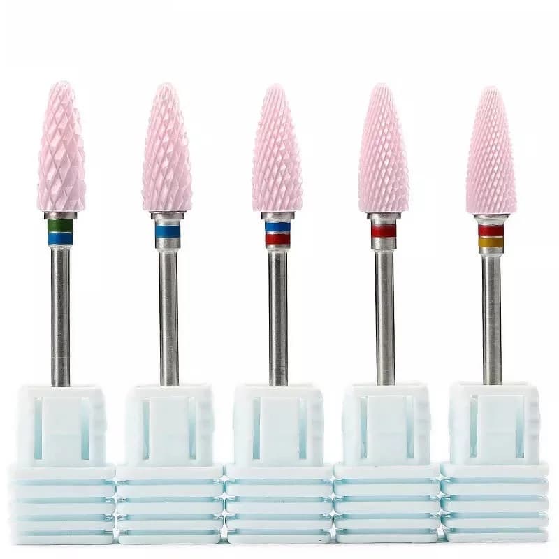 Pink ceramic cutters for manicure, tools for equipment that remove electric nail tips with nail polish gel