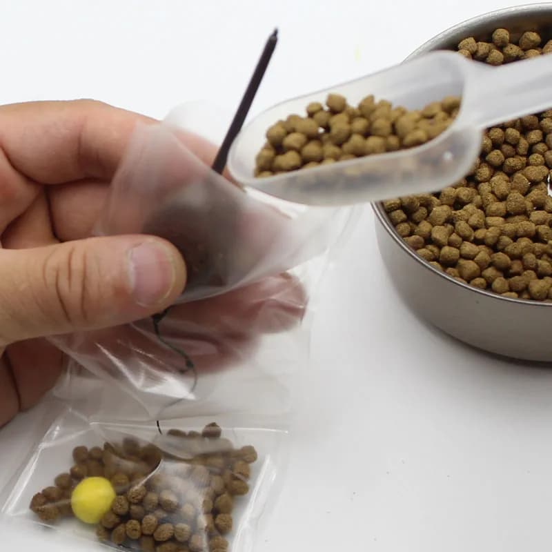 40PCS Sacchetti in PVA Disponibili Attrezzatura da pesca alla carpa Borsa in PVA Maglia per carpa Grossolana Boilie Pellet Esche Alimentatore per pesca al mais