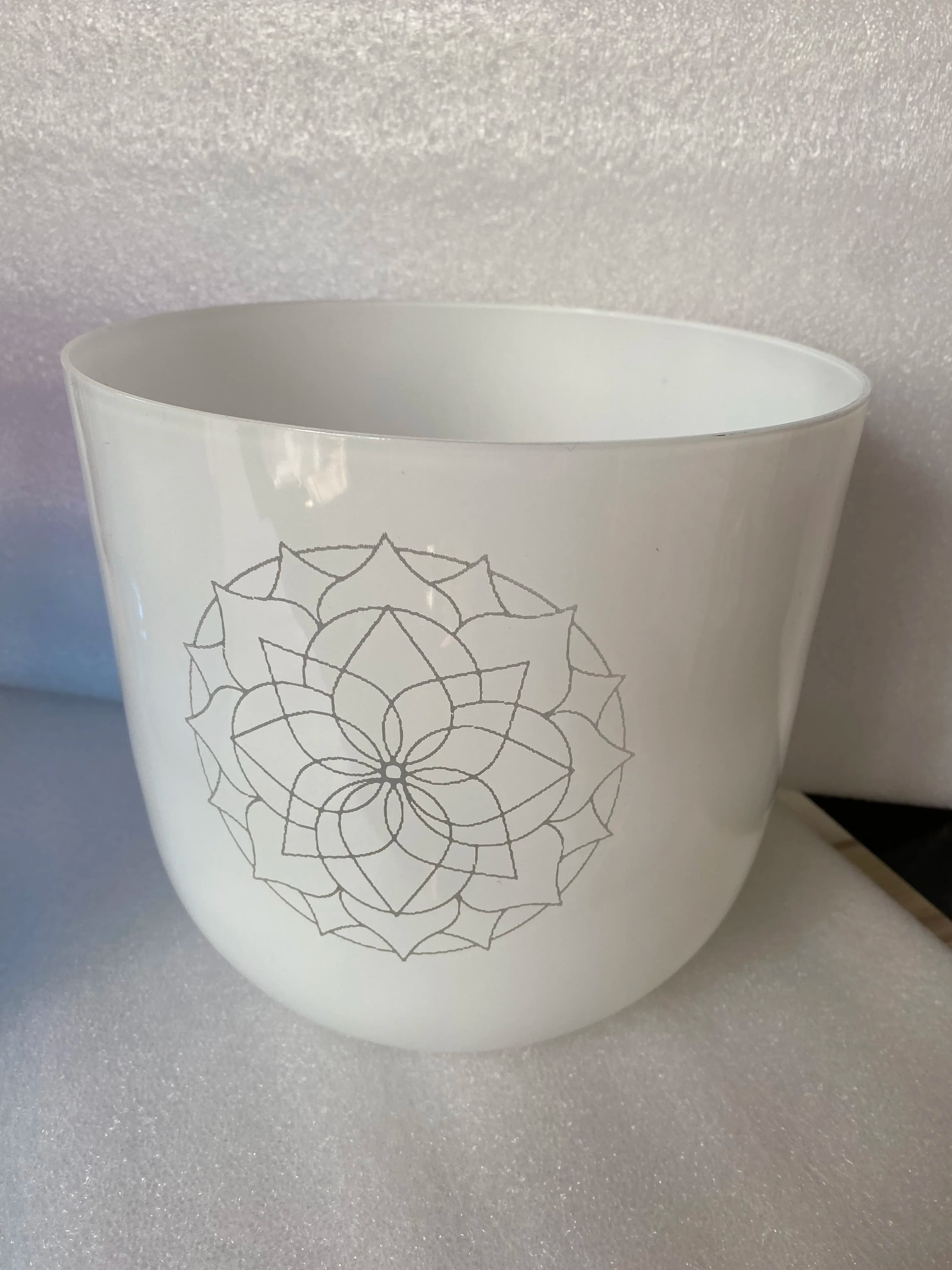 White color crystal singing bowl with engravings 3rd octave B note perfect pitch 432Hz for sound healing.