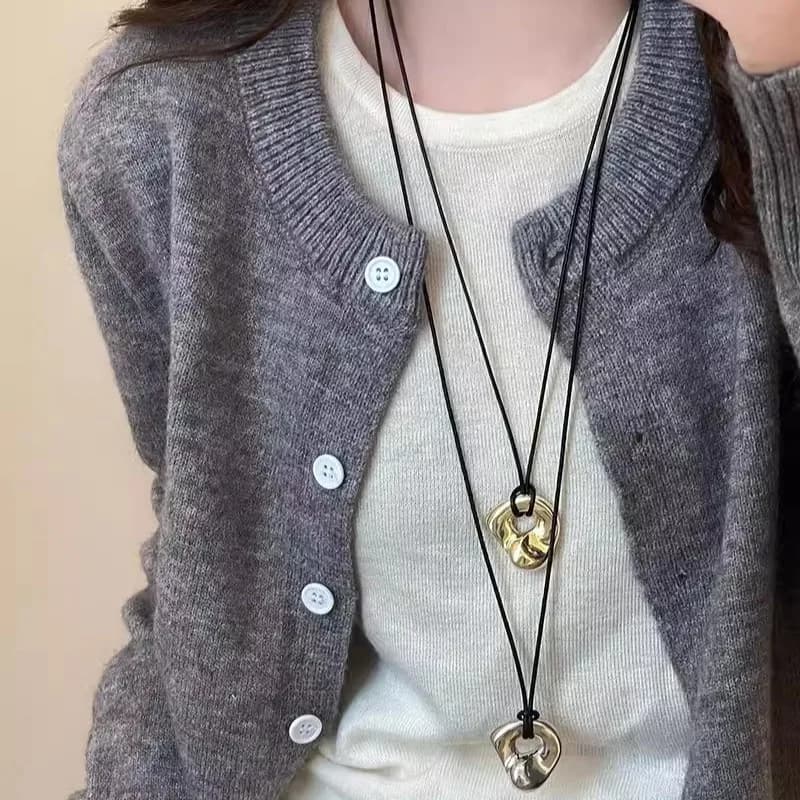 Japanese-style abstract hollow metal pendant necklace for women, minimalist fashion, long leather cord sweater chain, light luxu