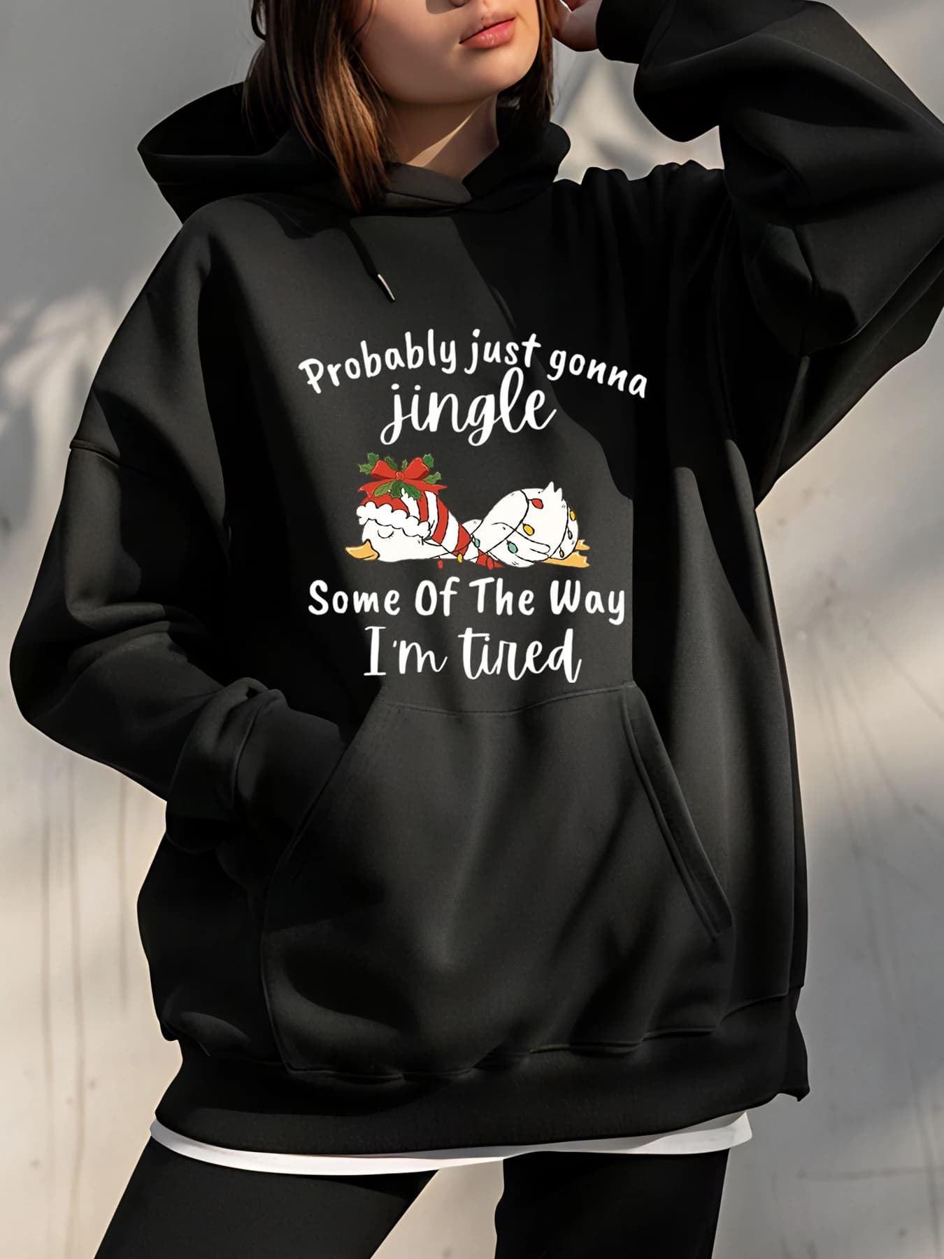 Christmas hoodie for cats with Jingle text and festive design for a cozy Christmas dress
