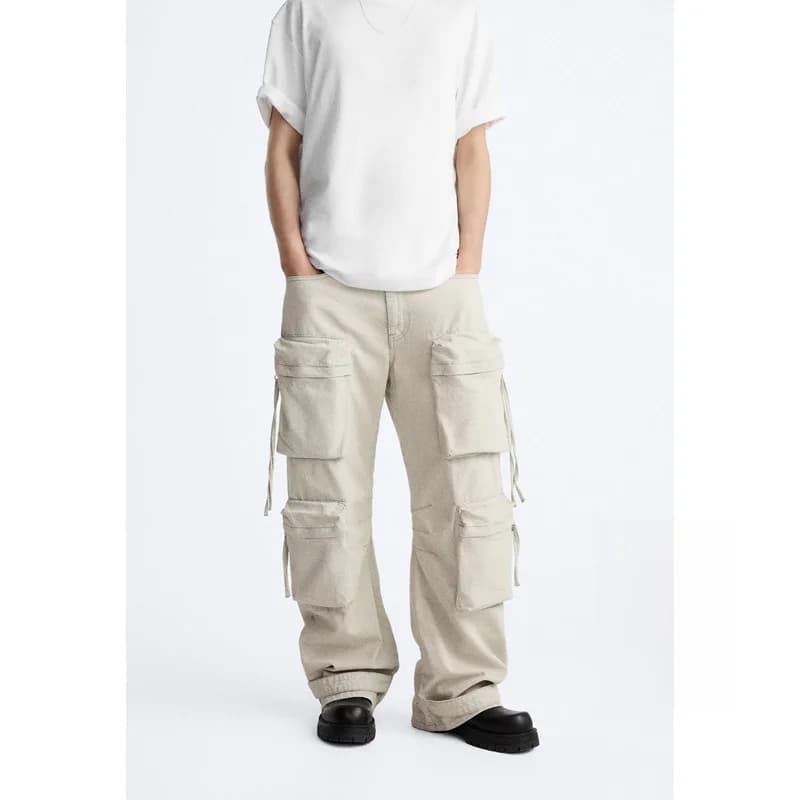Pantaloni jeans larghi casual da uomo con tasche multiple e cinture, pantaloni da lavoro in denim di cotone alla moda per giovani, moda primaverile