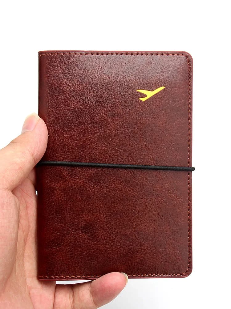 Nuova custodia per passaporto in pelle da uomo, portafoglio da viaggio ultrasottile da donna, custodia per passaporto con fascia elastica antifurto per carte di credito