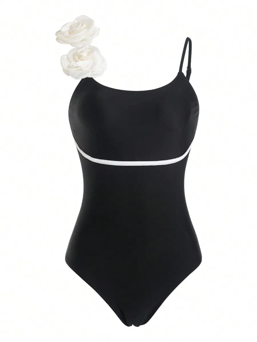 Costume da bagno intero nero da donna con finiture bianche e dettagli floreali