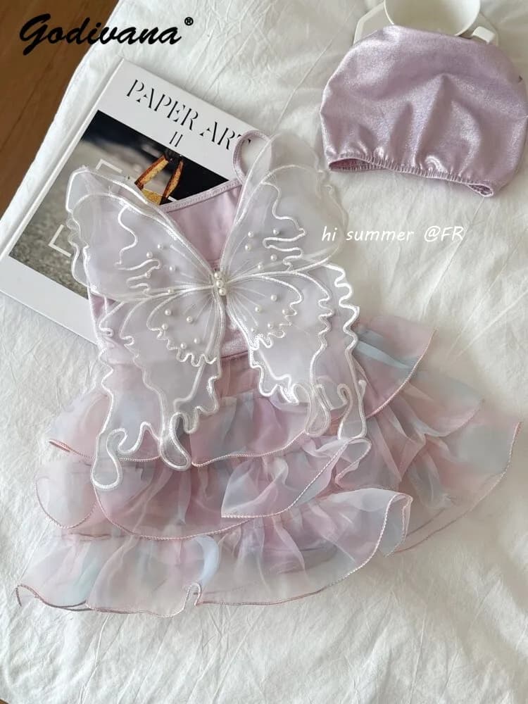 Costume da bagno intero in tulle per bambine, modello 2026, nuovo estivo, con ali di farfalla, stile principessa fatata, con volant e cuffia da nuoto
