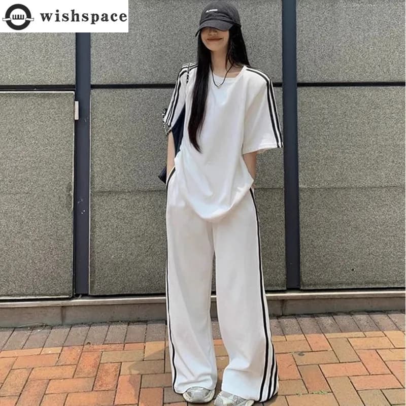 Primavera/estate Set Casual allentato t-shirt a maniche corte a righe da donna che indossa pantaloni a gamba larga spazzanti da pavimento Set a due pezzi