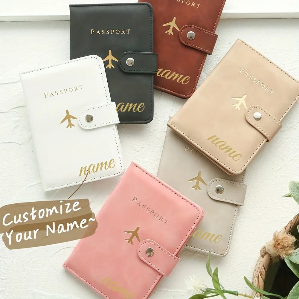 Customizable passport holder featuring a chic clasp and personalized name detailing; a handcrafted, elegant travel accessory