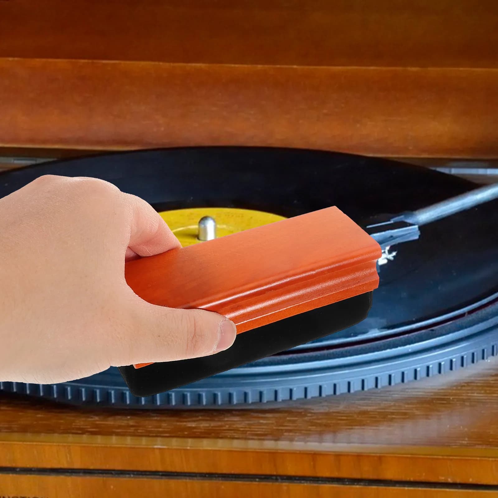 Gentle brush for vinyl discs with wooden handle and soft sponge design, cleans debris without scratching, ideal for vintage turntables.