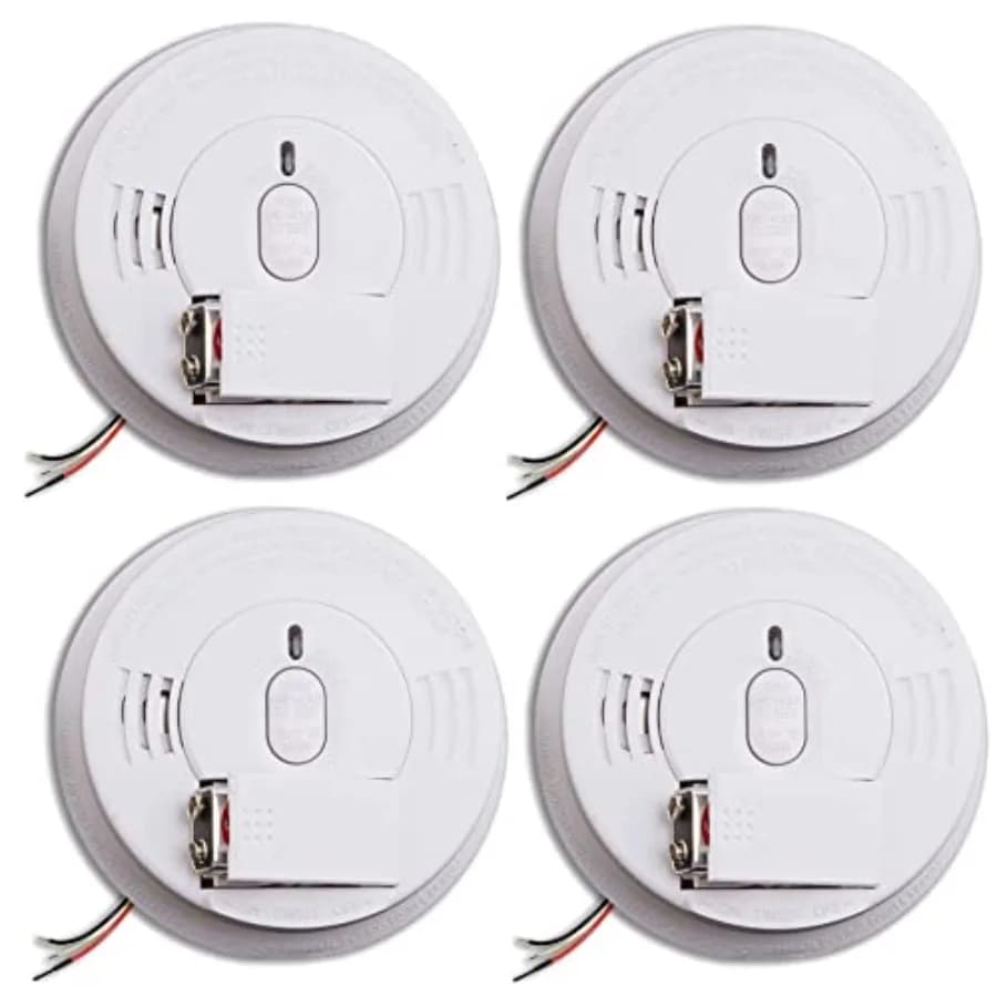 Hardwired smoke detector with battery backup for home safety, white ABS plastic, front-load battery door and test-silence butto