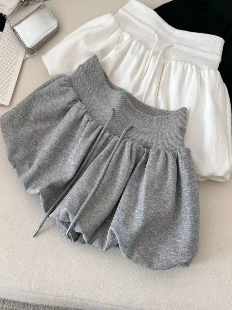 Nuova gonna midi con coulisse per ragazze alla moda, snellente, con elastico in vita a trapezio, gonna corta soffice e versatile da donna