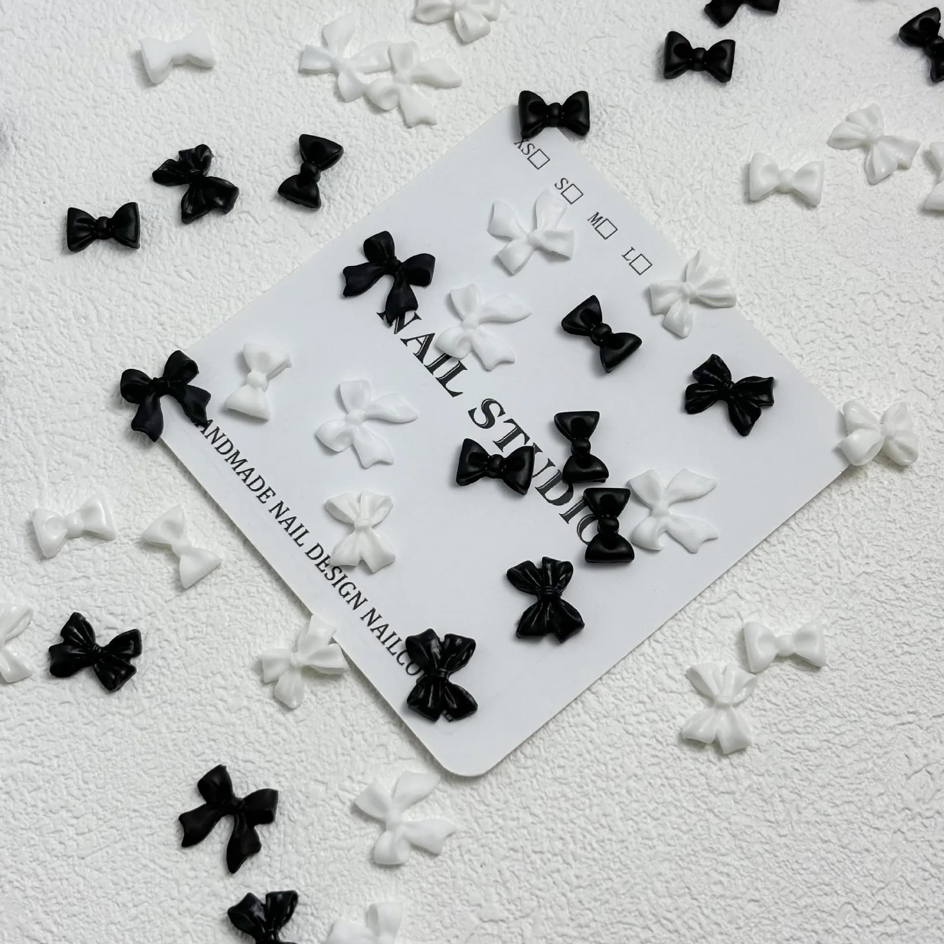 Classico nero bianco accessori per nail art fiocco riso bianco papillon unghie decorazioni 3D ciondoli in resina per unghie con diamanti strumento per manicure fai da te