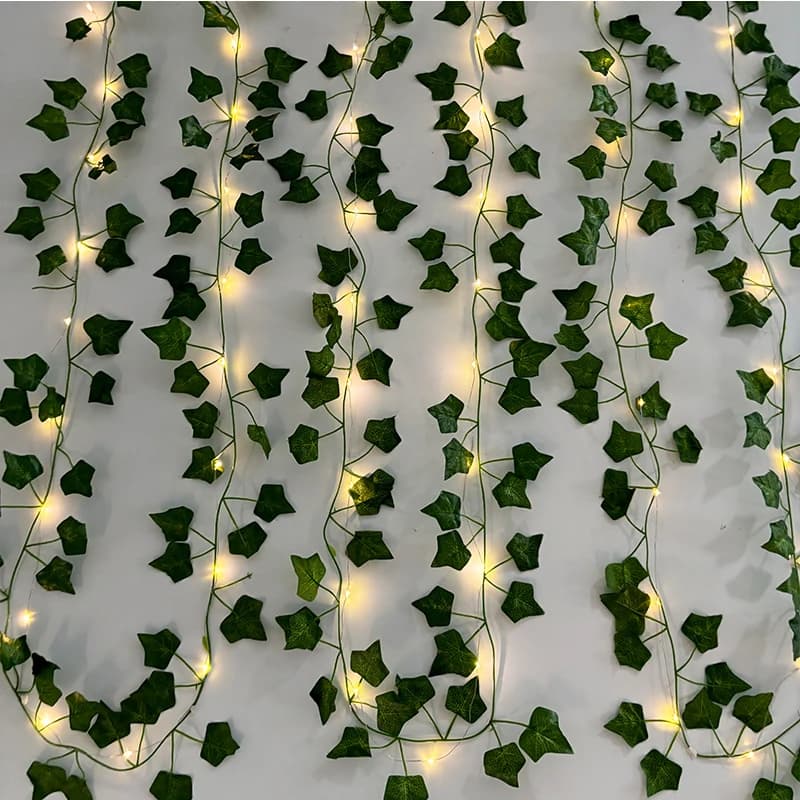 Wall faces with artificial edera plants with led fake vines of green eera leaves bright silk decoration jungle wall light outdoor