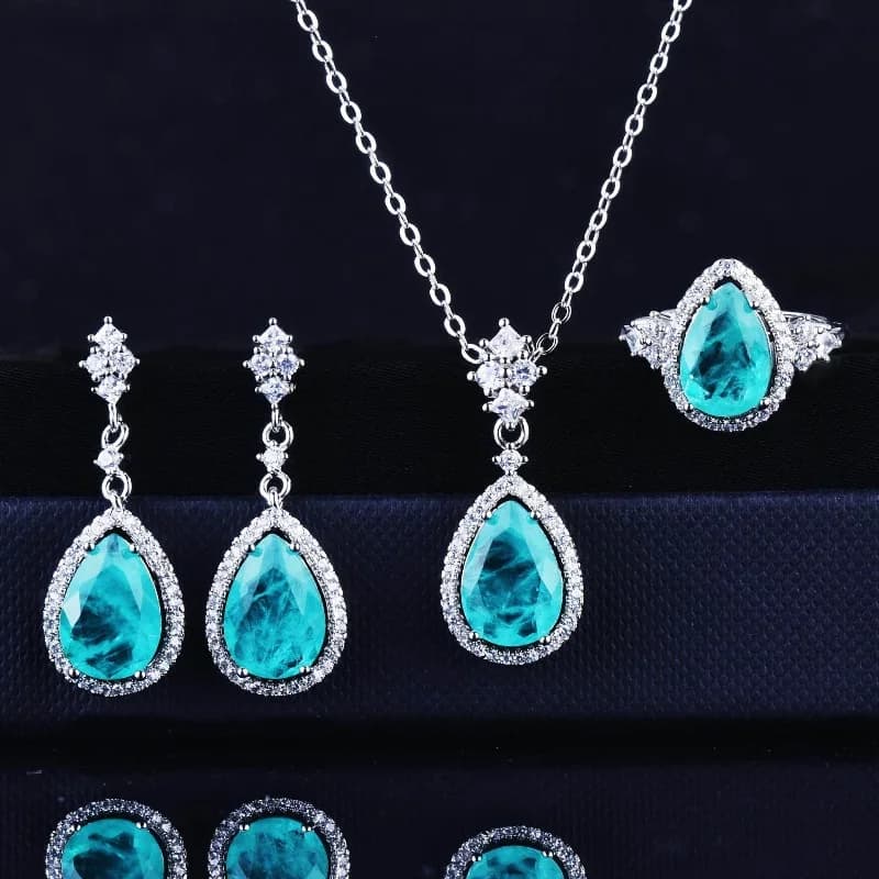 Nuova imitazione Paraiba Suit da donna di lusso con diamanti pieni Anello aperto Tesoro colorato Orecchini a bottone Collana con goccia d'acqua