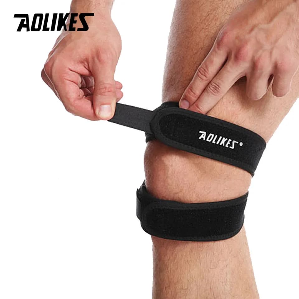 AOLIKES 1PCS Pressurizzato Ginocchio Wrap Supporto Del Manicotto Fasciatura Pad Elastico Bretelle Foro Ginocchio Ginocchiera Basket Sicurezza Tennis Ciclismo