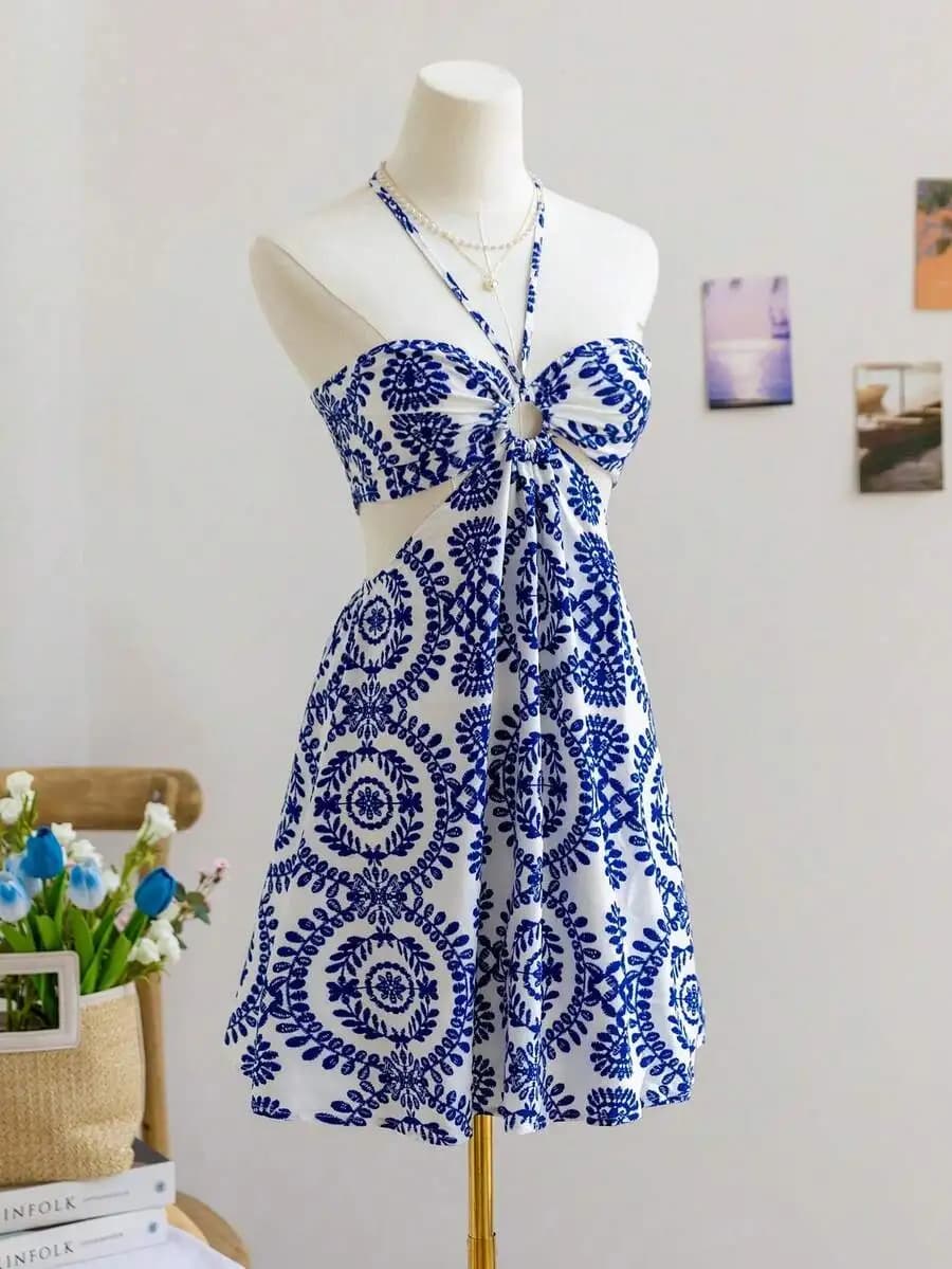 Abito estivo da donna con stampa floreale blu e bianca, collo all'americana, scollo a V e vita arricciata