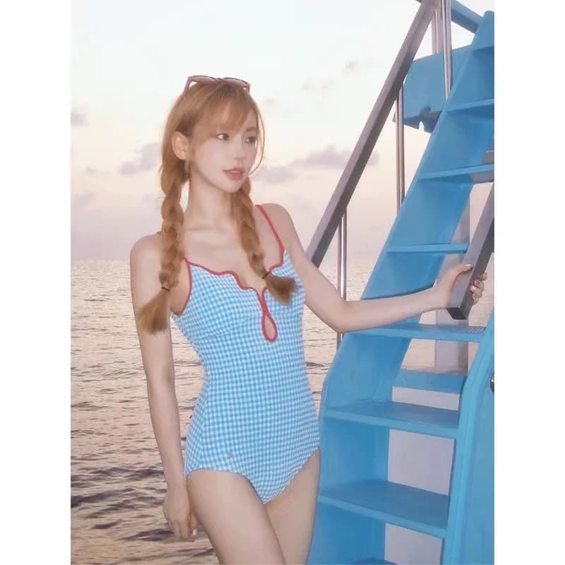 Gingham full-size women's swimsuit with V-neck, thin shoulder straps, contrasting edge and cut-out, modelling, for summer and beach