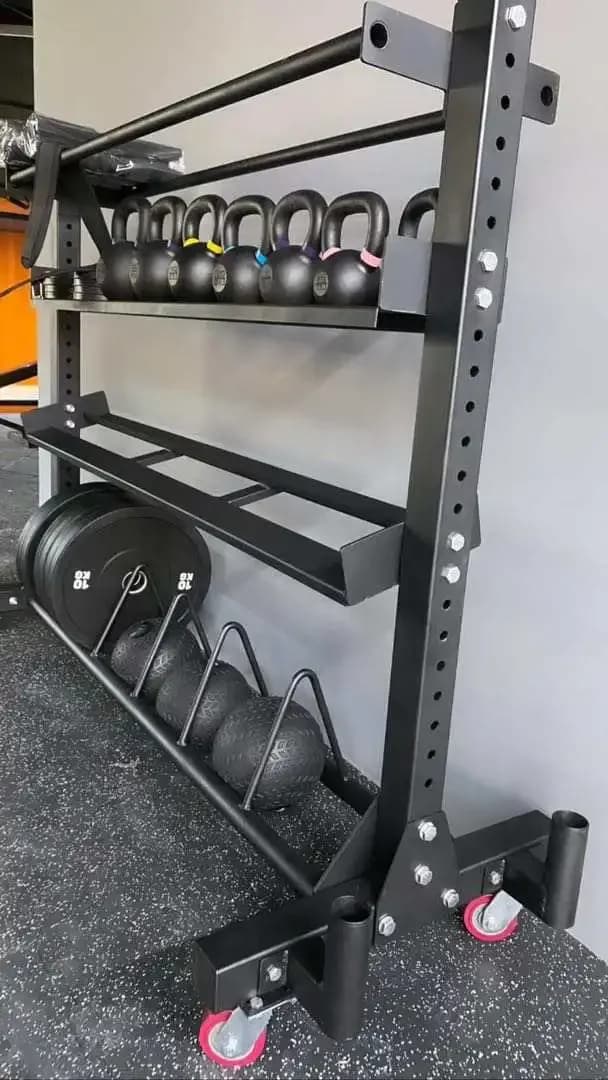 for storage rack contains kettlebells, handlebars, handlebars, wall balls, part of the bumper plates