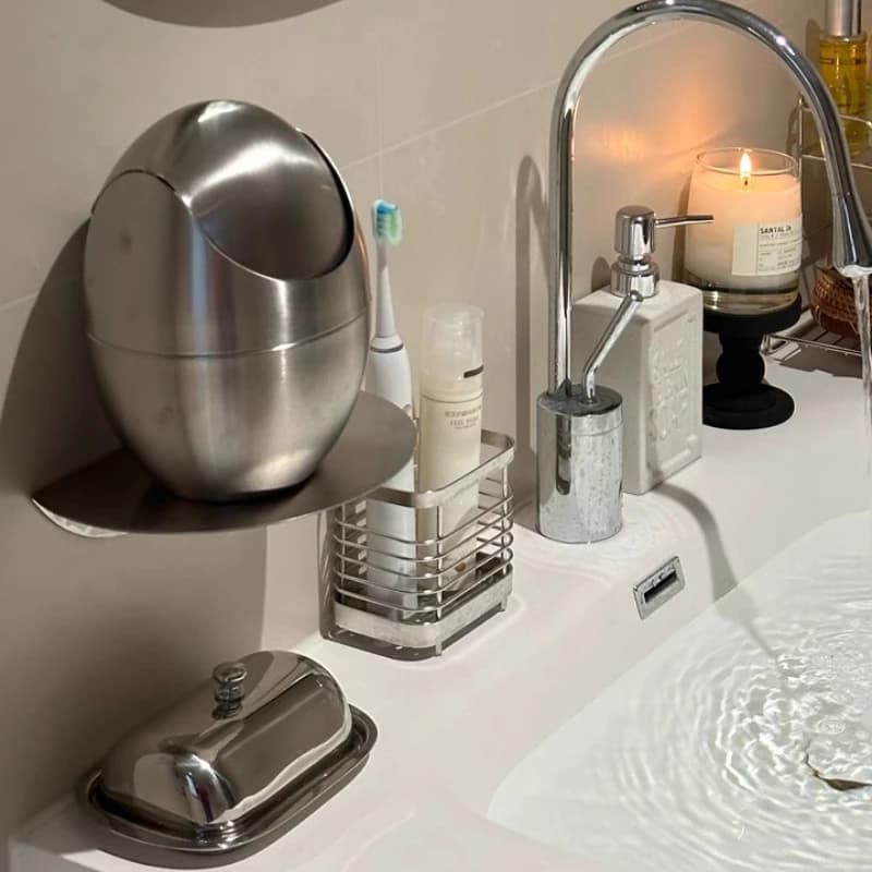 Bidone della spazzatura ribaltabile in acciaio inossidabile Contenitore da tavolo a forma di uovo per soggiorno Mini cestino per rifiuti portatile con coperchio Decorazioni per la casa moderne