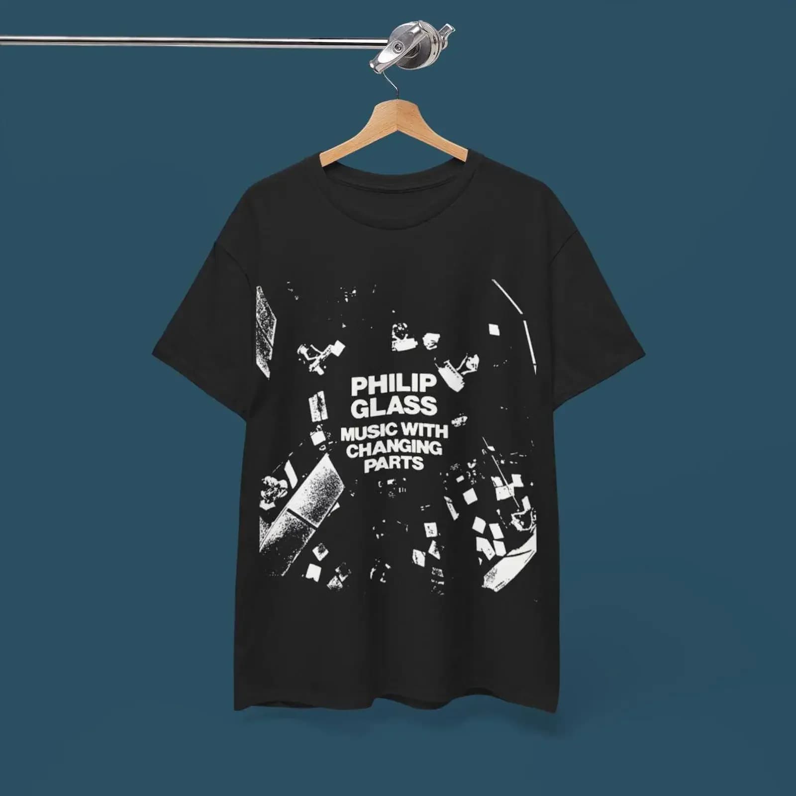 May include Black t shirt with a white graphic print of the album cover for Music Changing Parts by Philip Glass vintage Soft