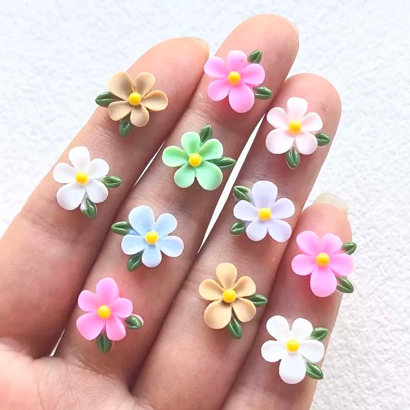 52 rhinestones in flower leaf shaped resin with 12 mm flat bottom, suitable for nail art, scrapbook, diy decorations for weddings and jewelry creations.