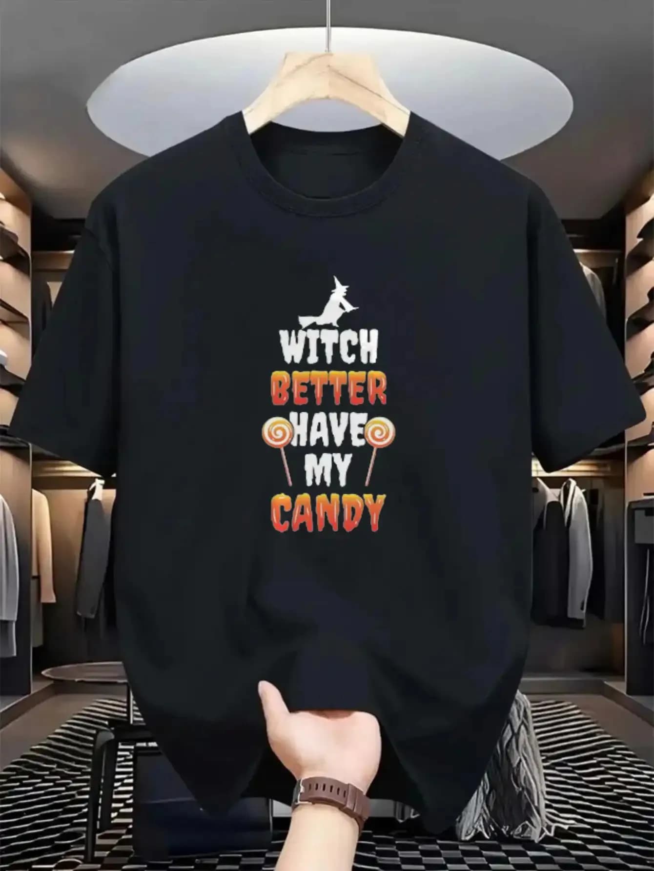 The funny Halloween t-shirt with the words "The Witch Must Have My Candy" - with witch fuck pattern and orange letters featured