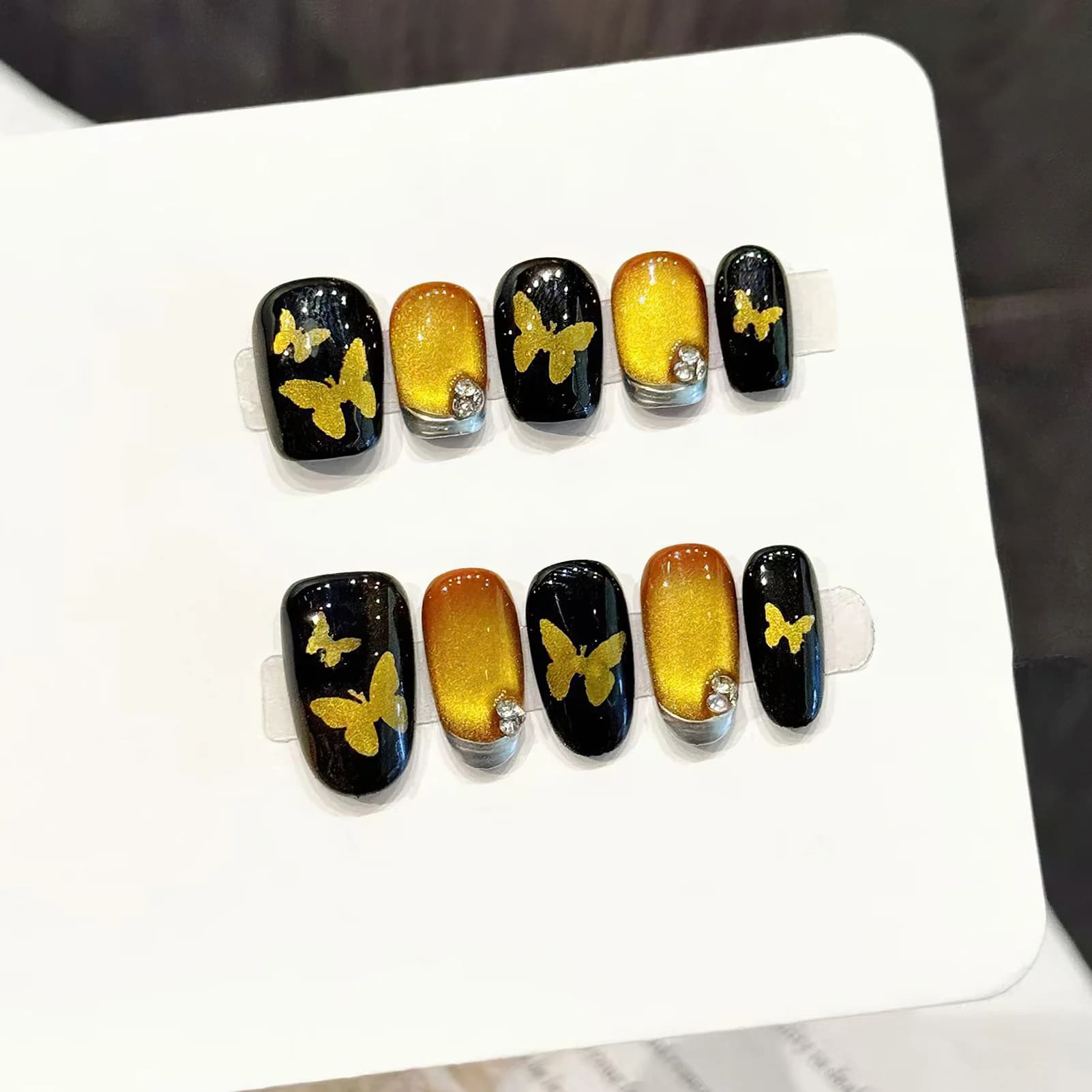 10 pieces of handmade fake nails with golden butterfly design and black cat eye effect, fake nail press-on for diy manicure, fake nails wearable for woman.