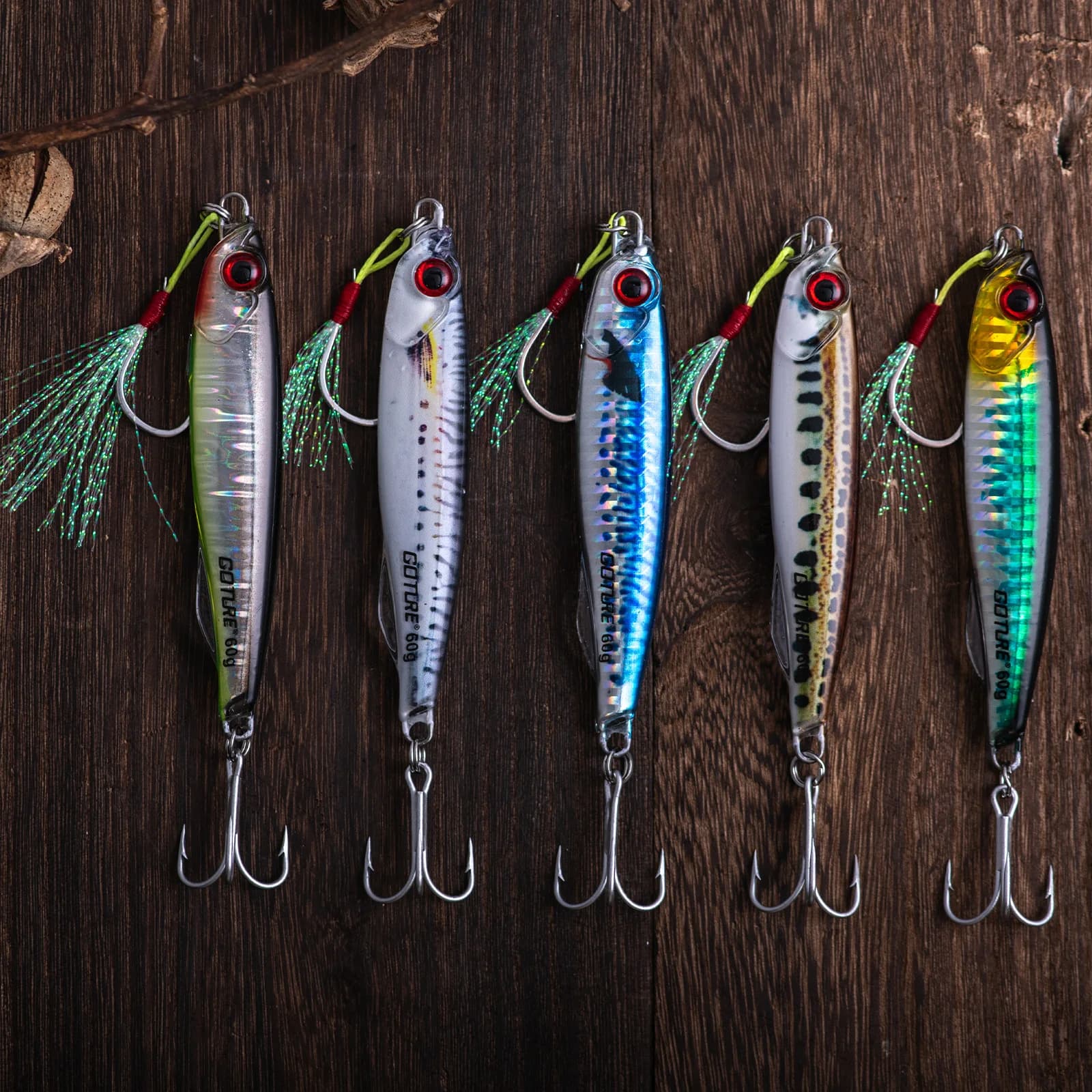 Esca artificiale Goture in metallo, tipo jig, wobbler, a forma di cucchiaio, per la pesca alla trota, con testa a amo singolo e coda in filo metallico brillante.