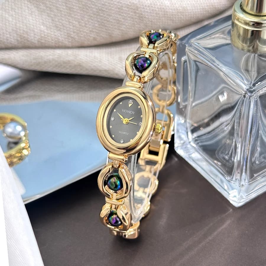 Set di custodie in lega ovale da donna con texture setosa con bracciale mobile con perline fini Quadrante con strass con stampa solare Orologio al quarzo da donna elegante