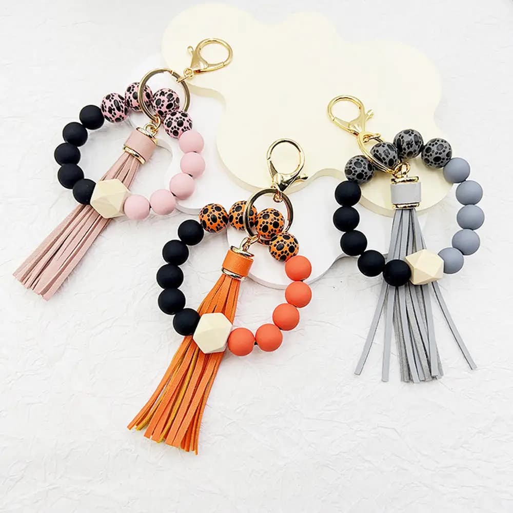 Portachiavi con perline in Silicone bracciale portachiavi da polso portachiavi per donna con ciondolo borsa nappa Boho farina d'avena