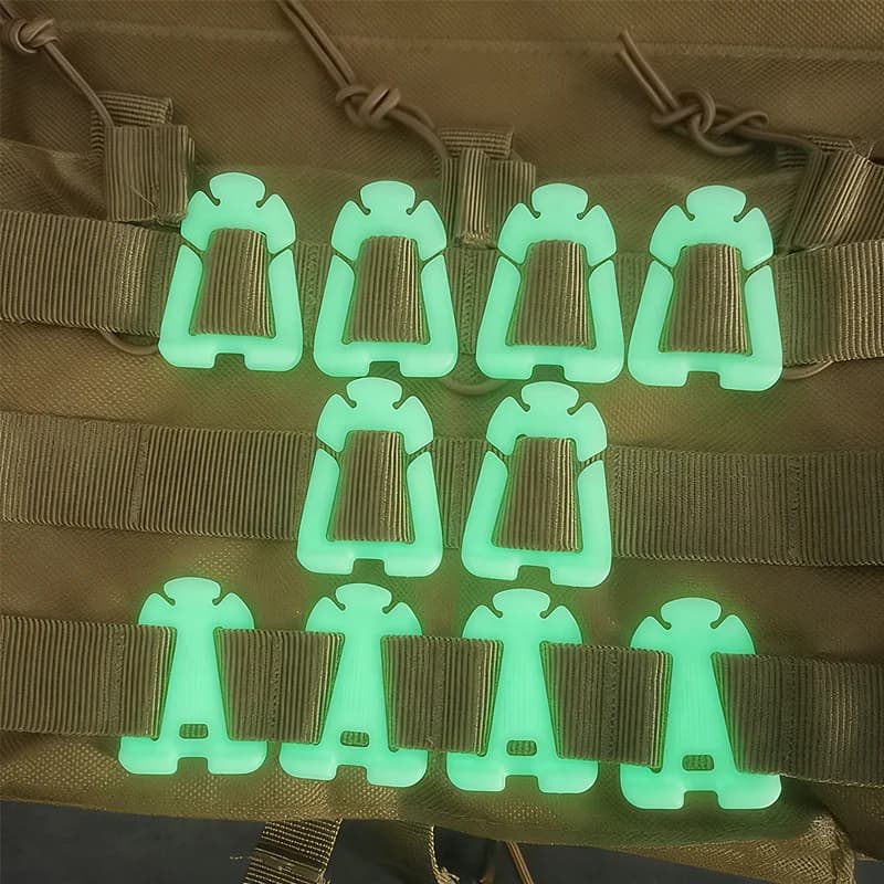 Luminous clip for MOLLE system, buckle for cable management and fixing, for tactical vests, hydration tubes, torque clip