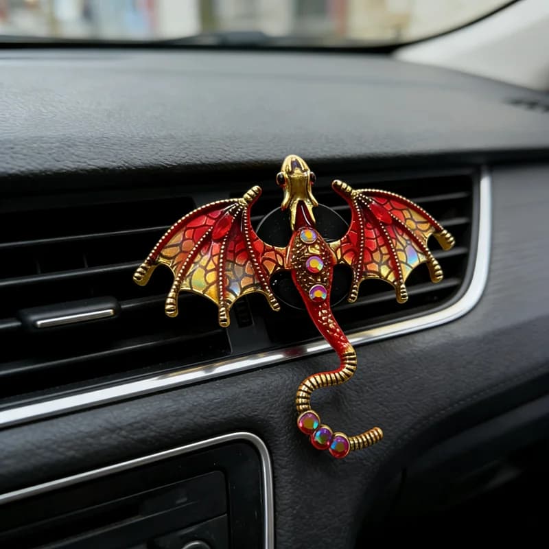 A small decorative dragon-shaped accessory for car air vents: a perfume clip used to refresh the air inside the vehicle.