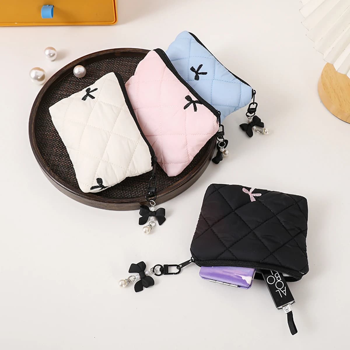 Elegante pochette trapuntata con fiocco, borsa da viaggio portatile per rossetto, auricolari e piccoli oggetti