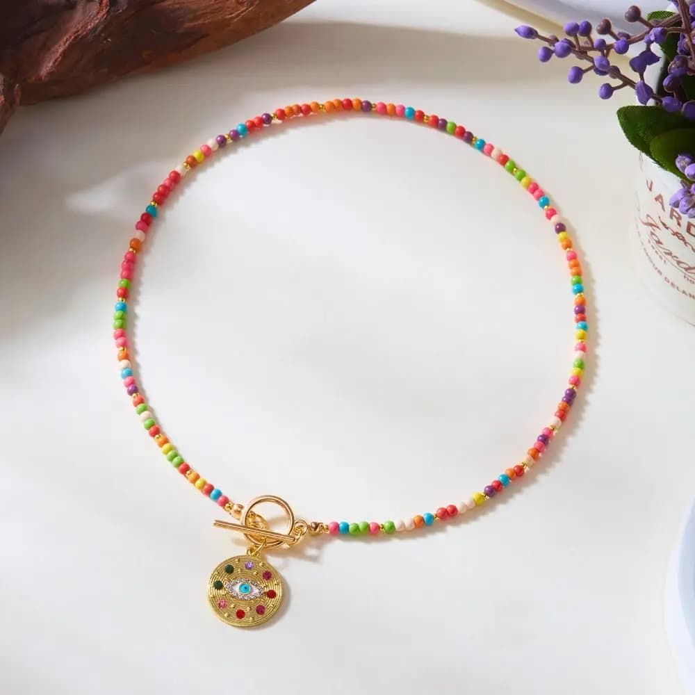 Collana girocollo con perline da 4 mm in pietra colorata, ciondolo a forma di occhio blu fatto a mano, stile boho, con catena di perline rotonde.