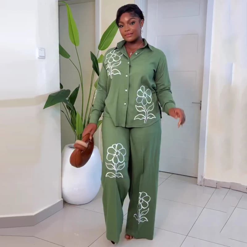 Set of stylish African women's trousers, wide shirt set with floral embroidery and wide leg trousers