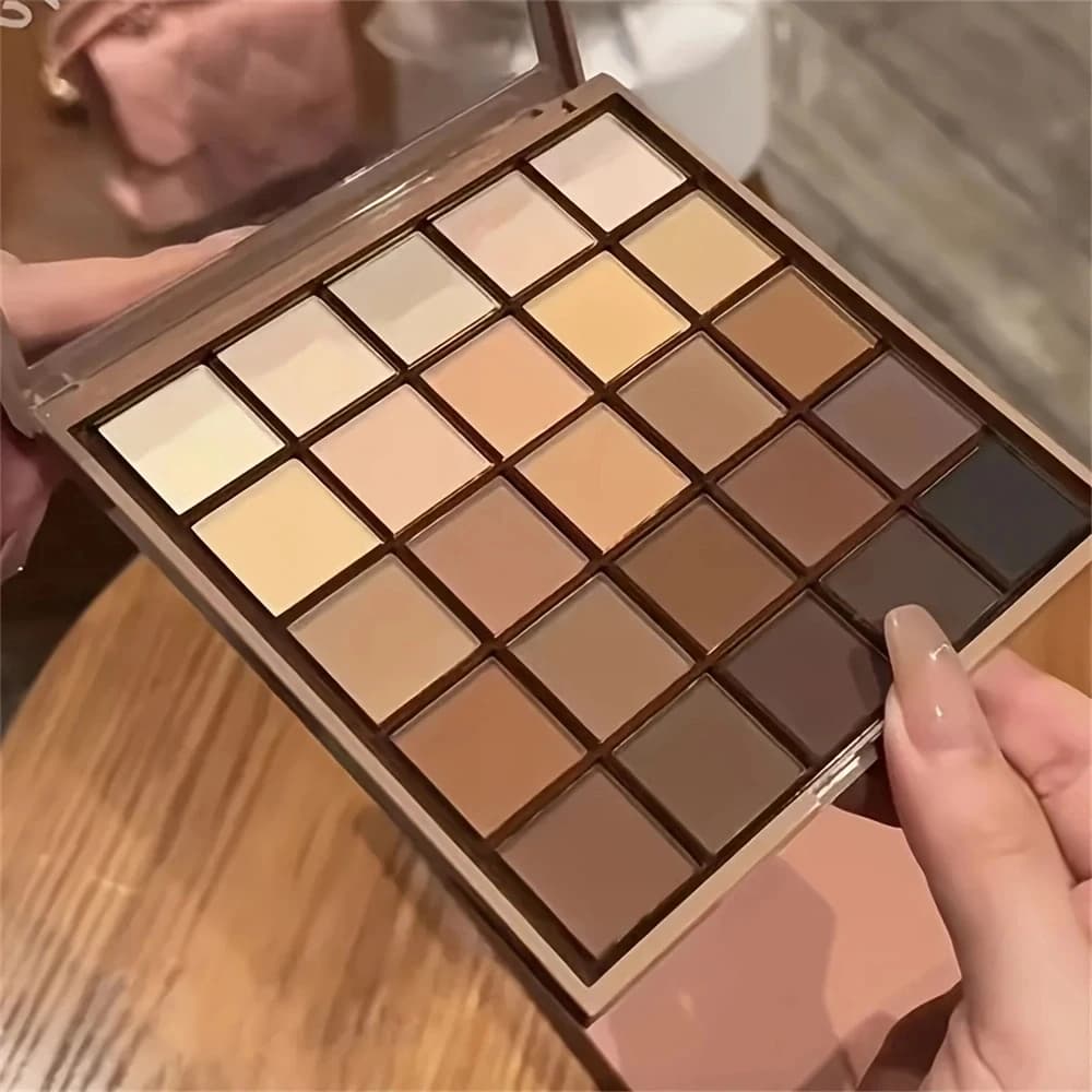 Palettes of shades of 25 colors: neutral gray tone and brown terrous, coffee and chocolate style, creates a multifunctional make-up with a natural look at the teapot