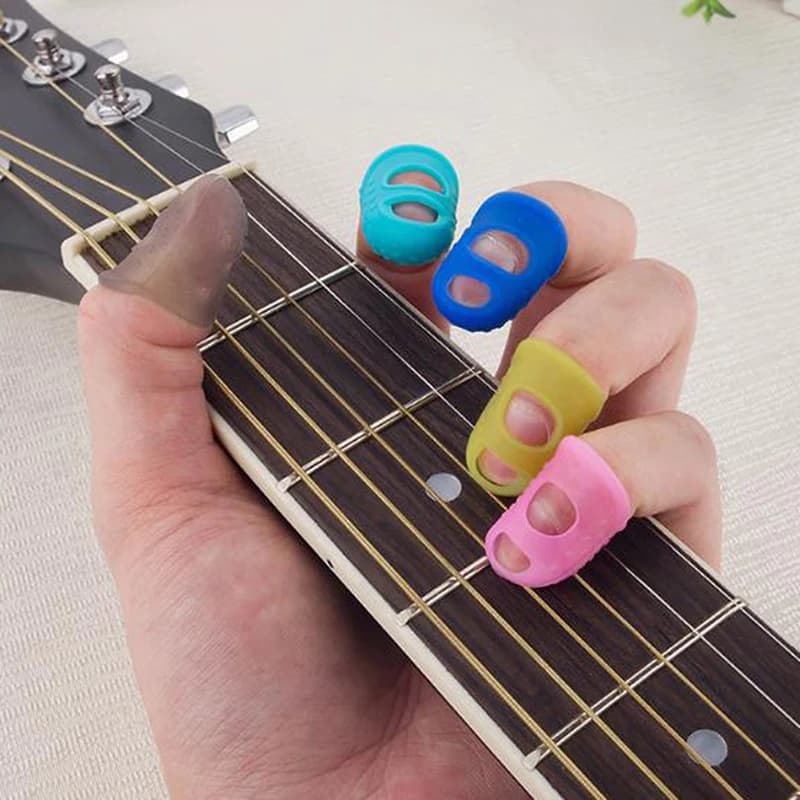 10pcs Silicone chitarra pollice Finger Picks Protector Plectrum Fingertip ditale Finger Guard safety protect caps 4 colori