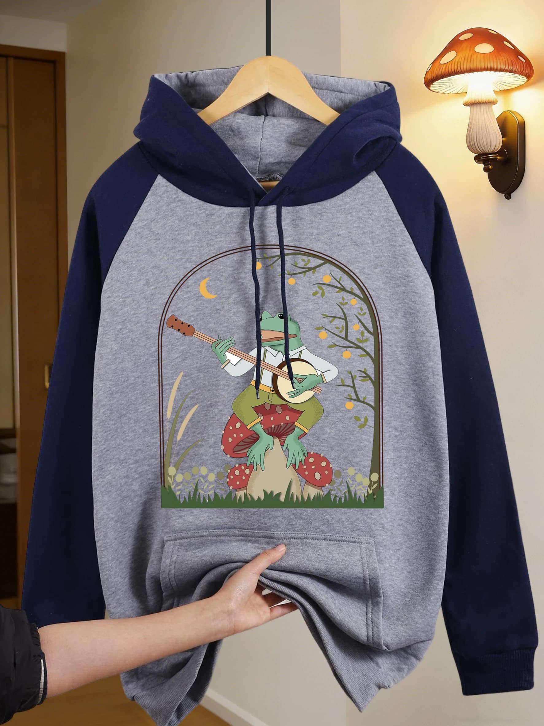 Unisex Hoodie in Autumn Pile with Rana Design Playing Banjo on a Fungus, Sports Casual Fashion, Large fit, Raglan Sleeves, Women's