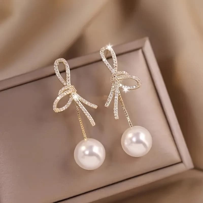 A pair of stylish women's pendant earrings with pendant, irregular creative bow pendant design, suitable for weddings, engagements, party anniversaries and daily wear