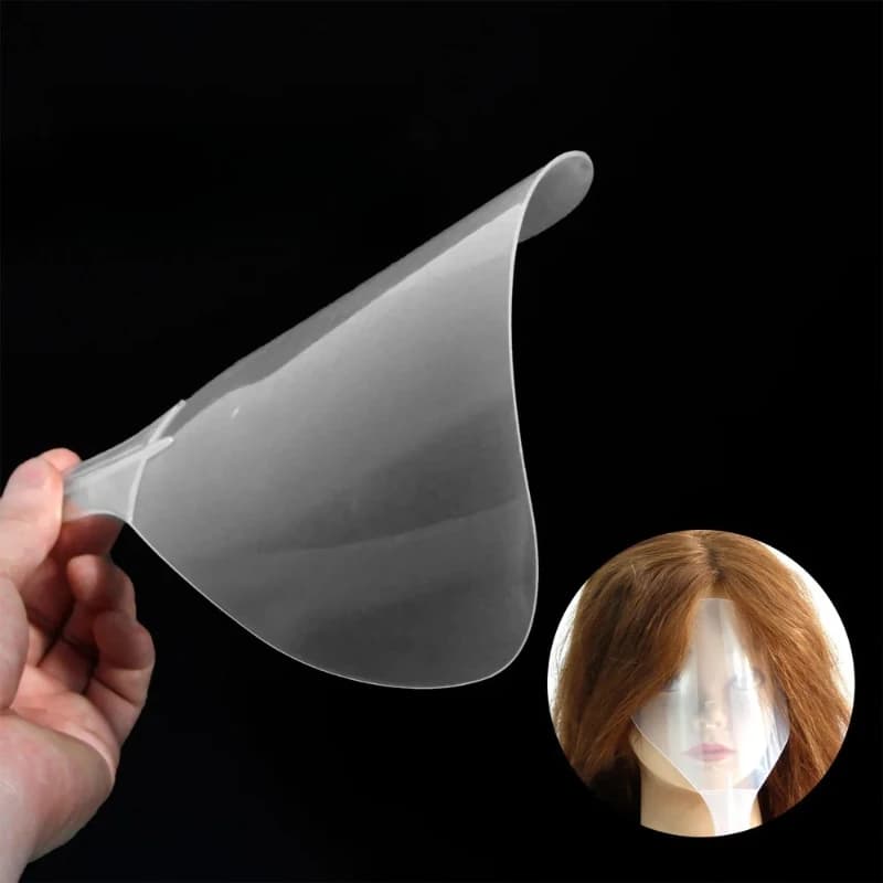 Transparent hair gel mask, face-covering fringe cap, hair styling pad. Beauty salon facial and eye care products.