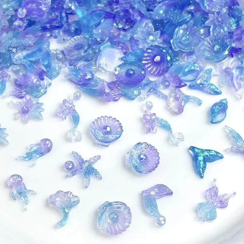 50 pz Dreamy Sparkling Shell Coda Pendenti E Ciondoli Per Unghie Luminoso Blu Viola Splicing Creature Marine Resina Unghie artistiche Decorazione Unghie FAI DA TE