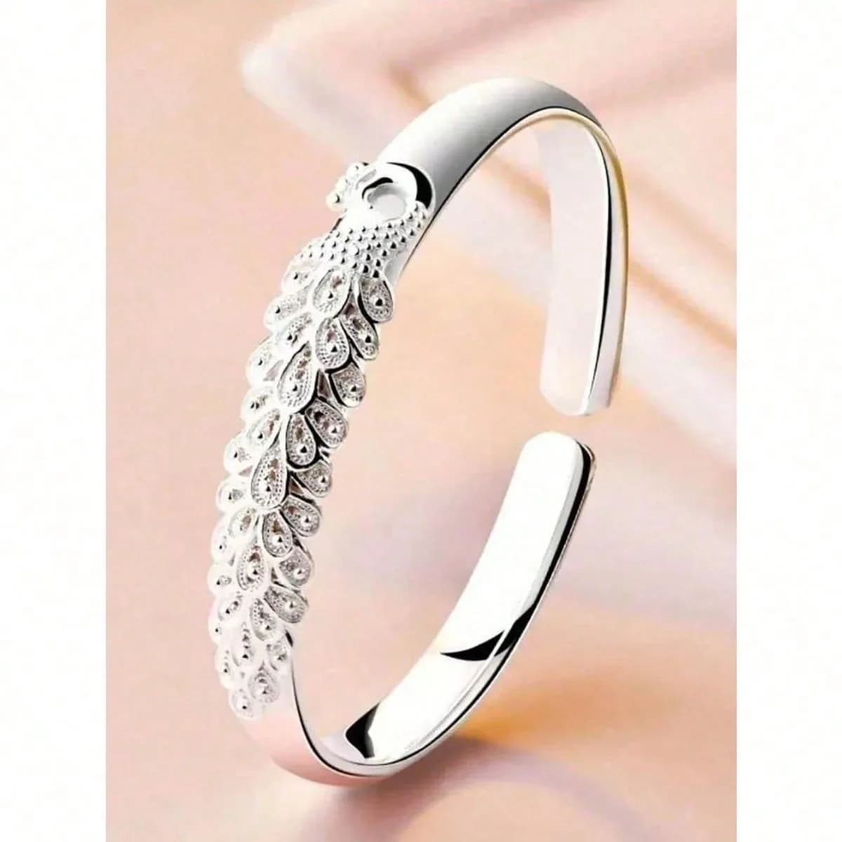 1 Peacock Spread Bracelet - Luxurious Designer Women's Open Bracelet, Original Jewelry Gift for Parties. Each 'feather petal' is finely polished and shiny. The bracelet fits the wrist curve snugly, comfortable to wear and doesn’t slip.