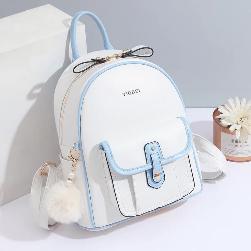 Elegant woman's backpack with structure in solid color, all combined with light backpack, simple decoration with small pompon pendant