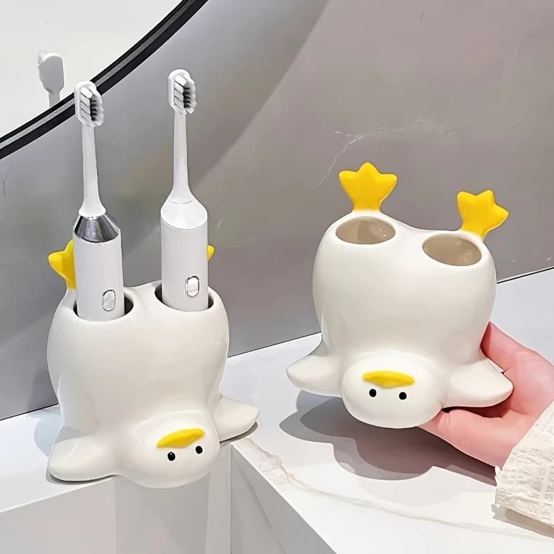 Penguin shaped toothbrush holder made of ceramic material, double slot electric toothbrush holder quirky bathroom sink accessory