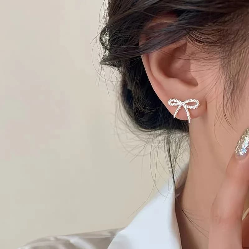 Silver Color Shiny Bowknot Stud Earrings for Charm Women Elegant Fashion Jewelry Light Luxury Hollow Accessories
